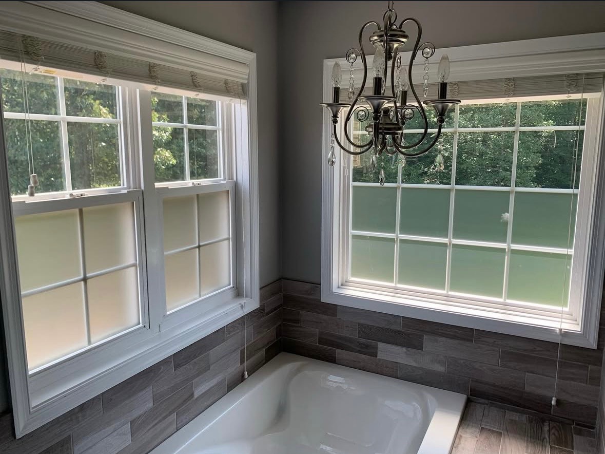 Bathroom with decorative frosted privacy film providing 24/7 privacy